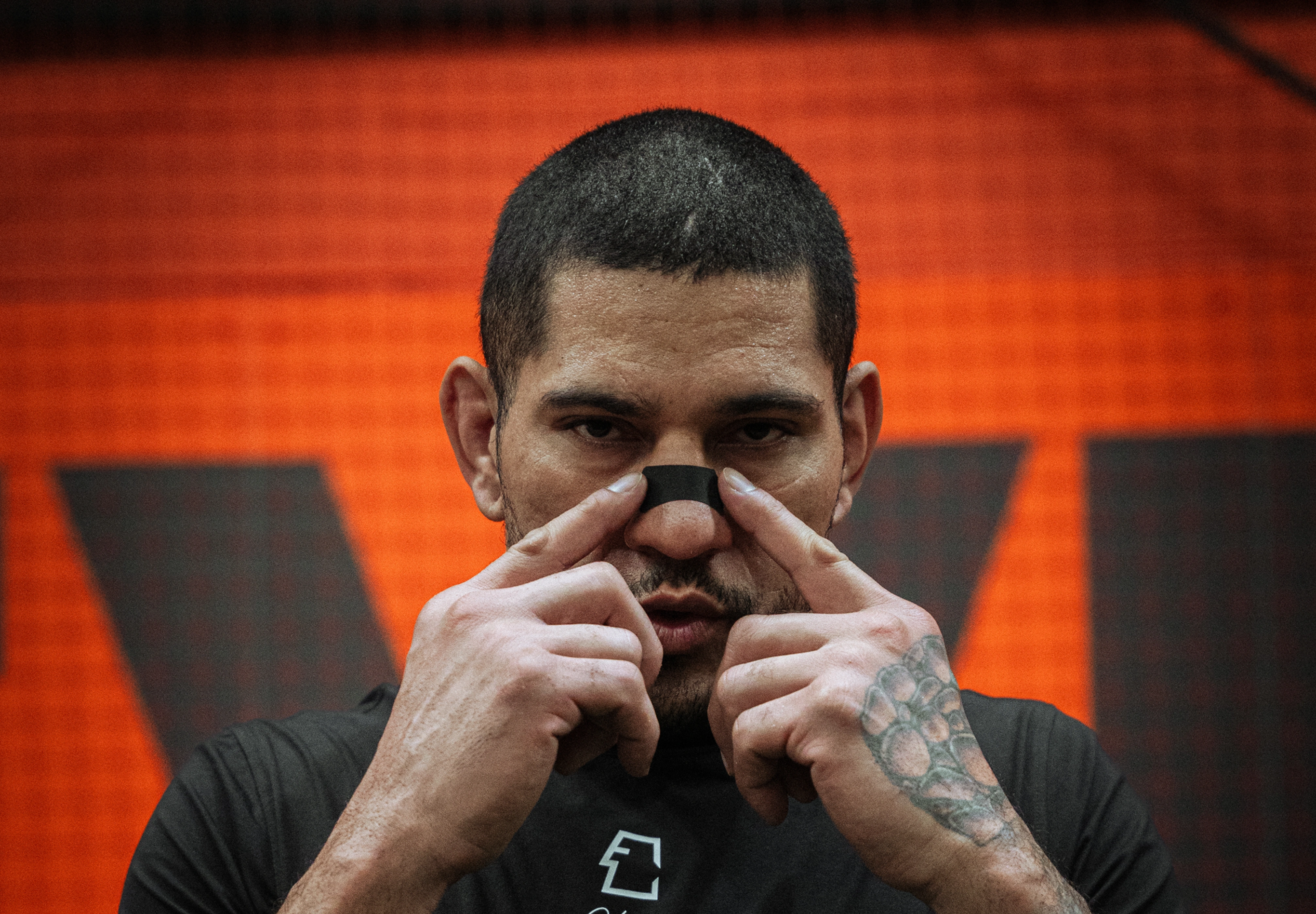 Close-up of athlete wearing black Breatheeze nasal strip — premium performance breathing aid comparison with GOAT.